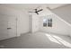 Attic bedroom features ceiling fan, closet doors, neutral walls and carpet at 7950 Country Knoll Rd, Bahama, NC 27503