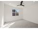 Bright bedroom featuring a ceiling fan and a window at 7950 Country Knoll Rd, Bahama, NC 27503