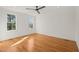 Bright bedroom with hardwood floors, neutral walls and white trim, lots of natural light at 7950 Country Knoll Rd, Bahama, NC 27503