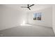 Bright bedroom featuring a ceiling fan and a window with natural light at 7950 Country Knoll Rd, Bahama, NC 27503