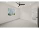 Bedroom boasting a ceiling fan, a window, neutral walls and carpet at 7950 Country Knoll Rd, Bahama, NC 27503