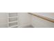 Closet with built in shelving and wooden rod at 7950 Country Knoll Rd, Bahama, NC 27503