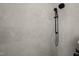 Close-up of tiled shower with dual showerheads and sleek, modern fixtures at 7950 Country Knoll Rd, Bahama, NC 27503