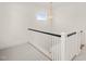 Elegant staircase landing with a stylish light fixture at 7950 Country Knoll Rd, Bahama, NC 27503