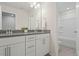 Bright bathroom features double vanity, mirror, and walk in shower at 813 James J Freeland Dr, Hillsborough, NC 27278