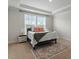 Cozy bedroom featuring a plush bed, neutral colors, and a sunlit window at 813 James J Freeland Dr, Hillsborough, NC 27278