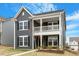 Beautiful two-story home with a welcoming front porch and lush green lawn, a perfect Gathering home at 813 James J Freeland Dr, Hillsborough, NC 27278