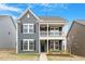 Charming two-story home with a quaint front porch and well-maintained lawn offers great curb appeal at 813 James J Freeland Dr, Hillsborough, NC 27278