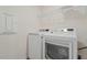 Laundry room with white appliances and wire shelving at 813 James J Freeland Dr, Hillsborough, NC 27278