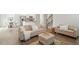 Open-concept living room with modern furnishings and seamless flow into the kitchen and dining areas at 813 James J Freeland Dr, Hillsborough, NC 27278