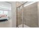 Modern walk-in shower with glass enclosure and tiled walls at 813 James J Freeland Dr, Hillsborough, NC 27278
