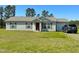 Charming one-story home features a well-maintained lawn and attached garage at 10 Golden Poppy Ln, Youngsville, NC 27596