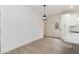 Bright dining area features hardwood floors, modern lighting, and access to outdoor area at 100 Gates St, Roxboro, NC 27573