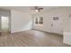 Spacious living room features hardwood floors, natural light, ceiling fan, and front door at 100 Gates St, Roxboro, NC 27573