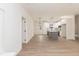 Open-concept living area with hardwood floors and seamless transition to the kitchen at 100 Gates St, Roxboro, NC 27573