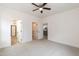 Spacious main bedroom features carpet, ceiling fan, and access to the bathroom and closet at 100 Gates St, Roxboro, NC 27573