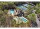 Aerial view of community amenities including multiple pools and tennis courts at 100 Lochberry Ln, Cary, NC 27518