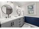 Modern bathroom with double sinks, and dark hardware at 100 Lochberry Ln, Cary, NC 27518