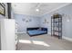 Comfortable bedroom designed with a bed frame and shelving, complimented by decorative wall art at 100 Lochberry Ln, Cary, NC 27518