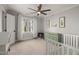 Bright bedroom with a window and a light green dresser at 100 Lochberry Ln, Cary, NC 27518