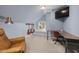 Spare bedroom with chair, desk, and view of outside at 100 Lochberry Ln, Cary, NC 27518