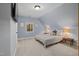 Comfortable carpeted bedroom featuring a vaulted ceiling and a window view to the outside at 100 Lochberry Ln, Cary, NC 27518