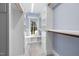 Well-organized walk-in closet with custom shelving and a window seat at 100 Lochberry Ln, Cary, NC 27518