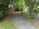 Neighborhood walking path surrounded by trees at 100 Lochberry Ln, Cary, NC 27518
