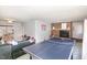 Spacious basement area with brick fireplace, ping pong table, and room for activities at 105 Elizabeth St, Chapel Hill, NC 27514