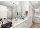 Bathroom with a large mirror, vanity, and a shower with glass doors at 105 Elizabeth St, Chapel Hill, NC 27514