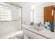 Clean bathroom features glass shower and vanity with generous storage at 105 Elizabeth St, Chapel Hill, NC 27514