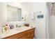 Bathroom featuring a wooden vanity, wide mirror, and shower stall at 105 Elizabeth St, Chapel Hill, NC 27514