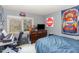 Functional bedroom with a bed, dresser, and a window view of the outdoors at 105 Elizabeth St, Chapel Hill, NC 27514