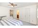 This bedroom has a ceiling fan, carpeted floor, and access to an office and bathroom at 105 Elizabeth St, Chapel Hill, NC 27514