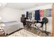 Bright bedroom with wood floors, neutral walls, and a window desk area at 105 Elizabeth St, Chapel Hill, NC 27514