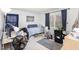 Compact bedroom featuring a bed, desk, and a mini-refrigerator for convenience at 105 Elizabeth St, Chapel Hill, NC 27514