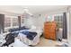 Neutral-toned bedroom with a couch, dresser, and natural light from two windows at 105 Elizabeth St, Chapel Hill, NC 27514
