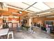 Spacious garage with exposed brick, wood paneling, and gym equipment at 105 Elizabeth St, Chapel Hill, NC 27514