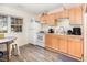 Efficient kitchen with wood cabinets, standard appliances, and a cozy breakfast nook at 105 Elizabeth St, Chapel Hill, NC 27514