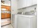 Bright laundry area with modern washer and dryer next to the kitchen at 105 Elizabeth St, Chapel Hill, NC 27514