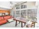 Bright sunroom with vaulted ceiling, ample windows, and comfortable seating arrangement at 105 Elizabeth St, Chapel Hill, NC 27514