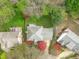 Charming home featuring lush landscaping, a large roof, and a private yard at 109 S Fern Abbey Ln, Cary, NC 27518