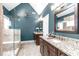 Bathroom with double vanities, granite countertops, and a glass-enclosed shower with tile surround at 109 S Fern Abbey Ln, Cary, NC 27518