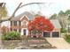 Beautiful brick two-story home with mature landscaping and a two-car garage at 109 S Fern Abbey Ln, Cary, NC 27518