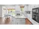 Gourmet kitchen with central island, breakfast bar, and view to the breakfast area at 109 S Fern Abbey Ln, Cary, NC 27518