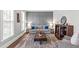 Sophisticated living room with stylish decor, panelled wall and lots of light at 109 S Fern Abbey Ln, Cary, NC 27518