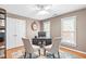 Home office with hardwood floors, bright windows, neutral paint and a ceiling fan at 109 S Fern Abbey Ln, Cary, NC 27518