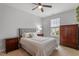 Cozy bedroom with two bedside tables, a window, and a dresser at 109 Shale Creek Dr, Durham, NC 27703