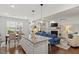 Open concept living area with kitchen island, large dining area, and a glimpse of the living room at 109 Shale Creek Dr, Durham, NC 27703