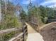 Enjoy an afternoon walk on this scenic wooded trail with bridge at 109 Shale Creek Dr, Durham, NC 27703
